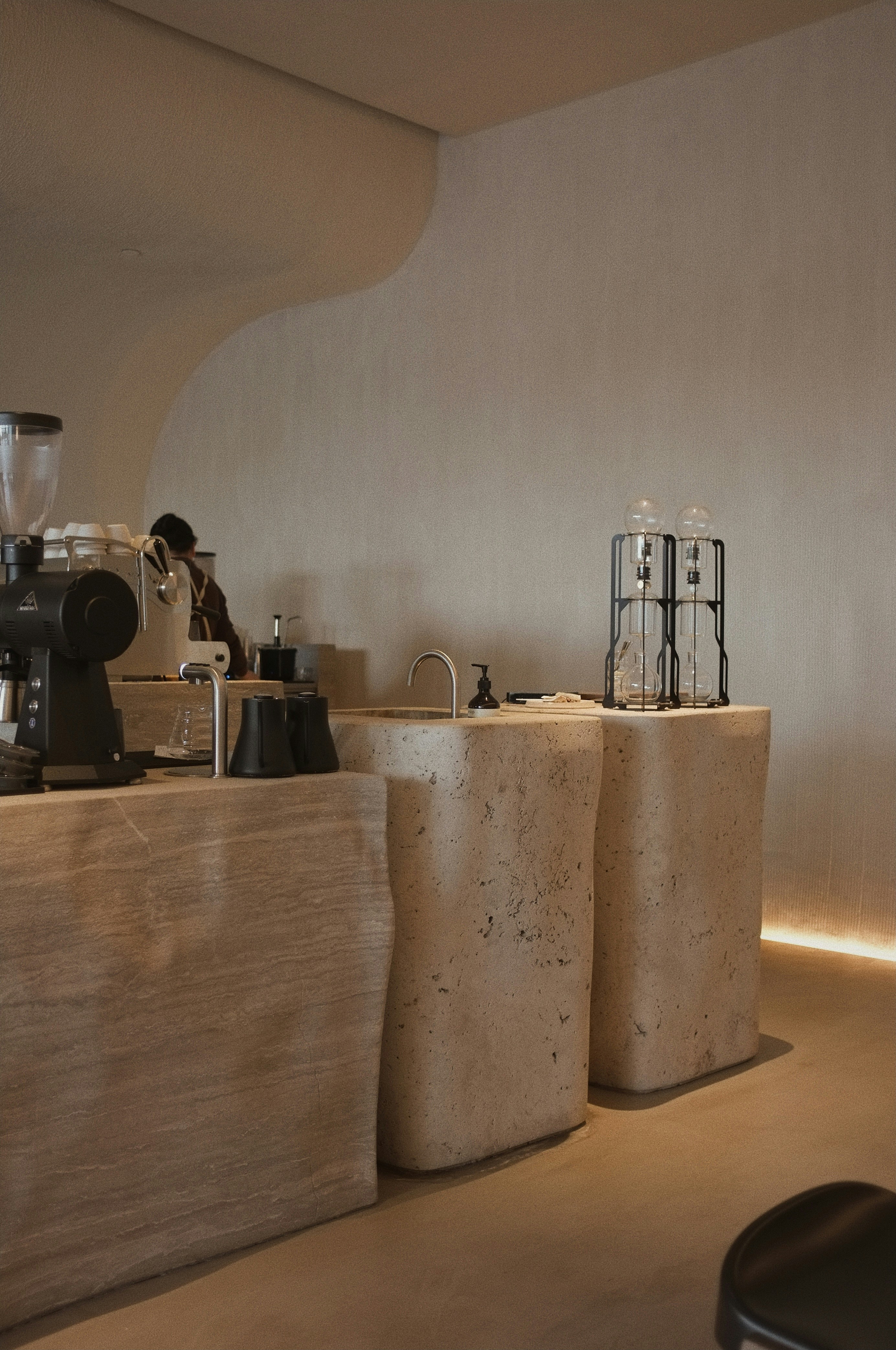 white and black coffee maker on brown wooden table