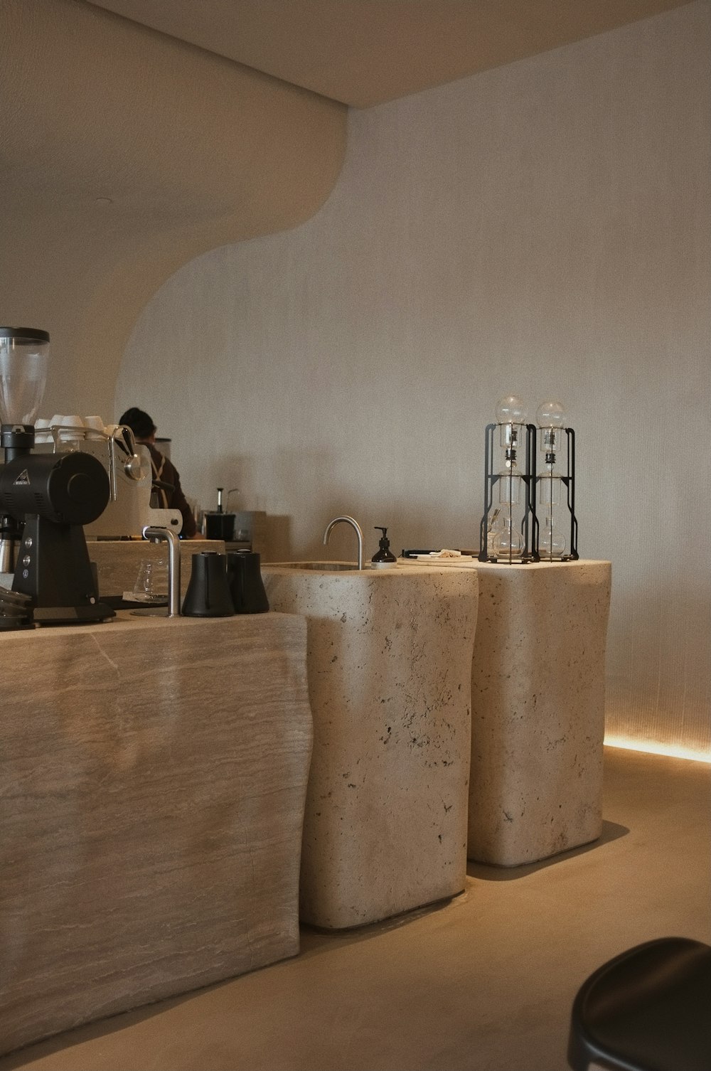 white and black coffee maker on brown wooden table