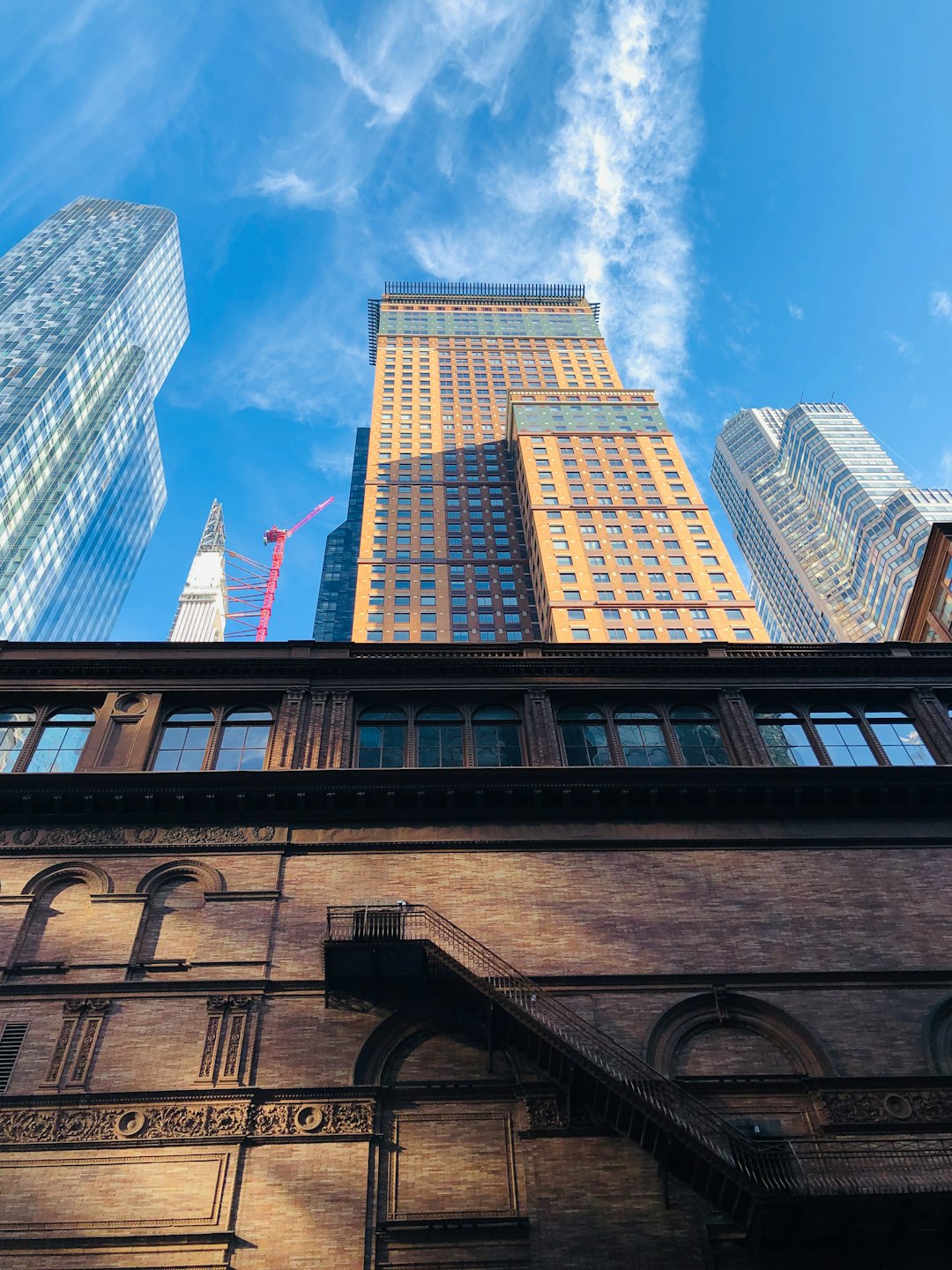 low angle photography of high rise buildings under blue sky during daytime