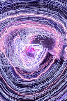 Close-up of a swirling vortex of colorful light representing dynamic brand energy.