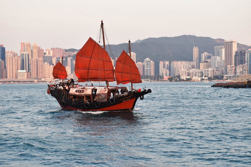 brown and white boat on sea during daytime