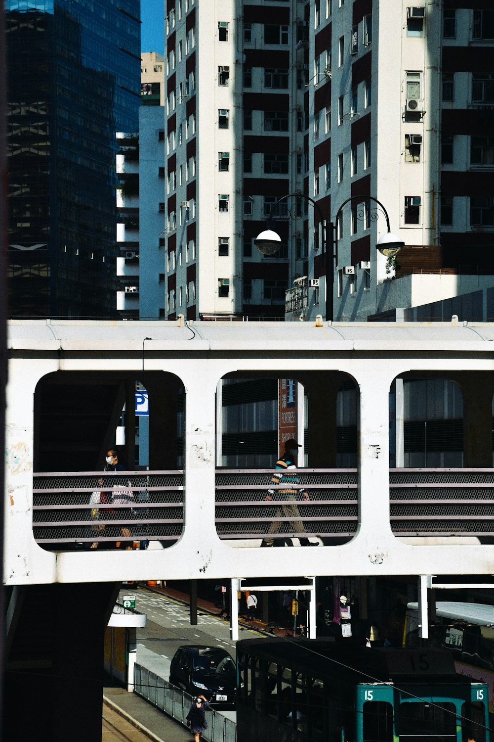 white and black train on the street during daytime