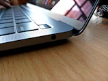 Stylish laptop angled to highlight its slim design and keyboard.