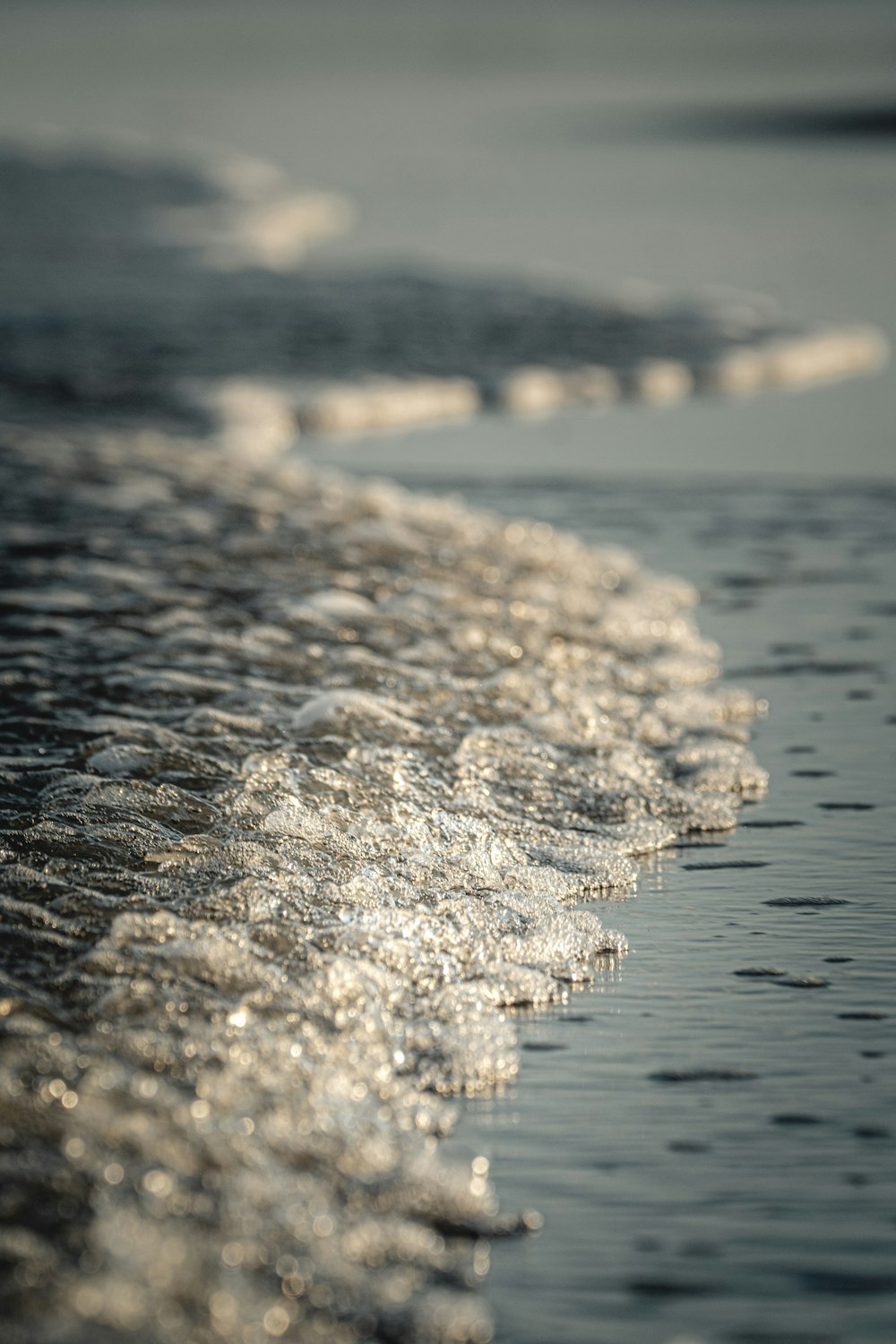 white and brown stone near body of water during daytime