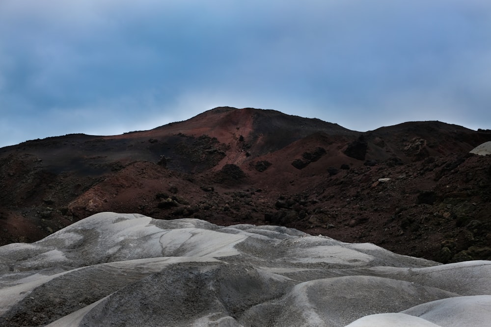 brown mountain under blue sky during daytime