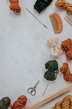 orange and white yarn on white table