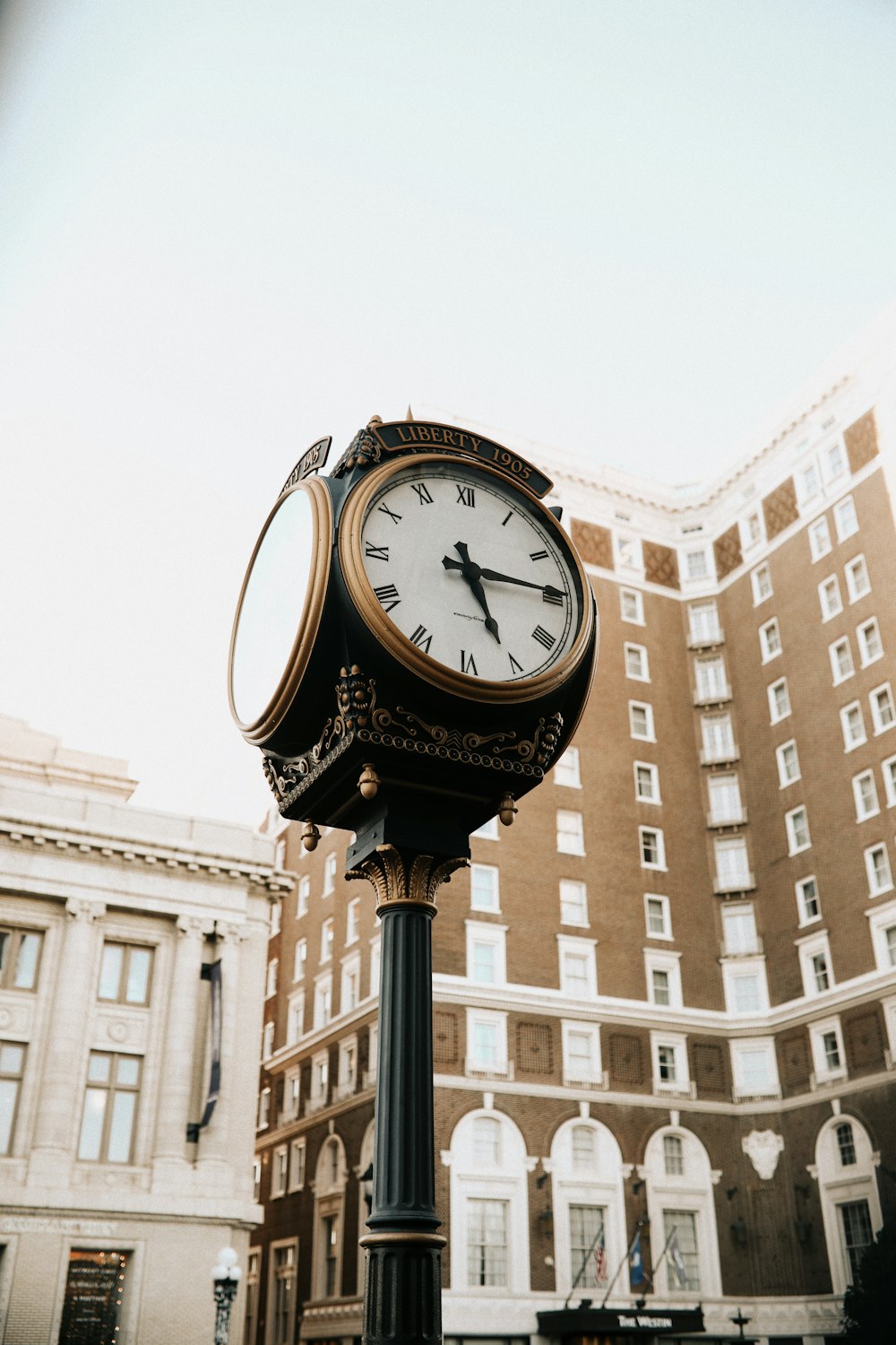 black and white analog clock at 10 00