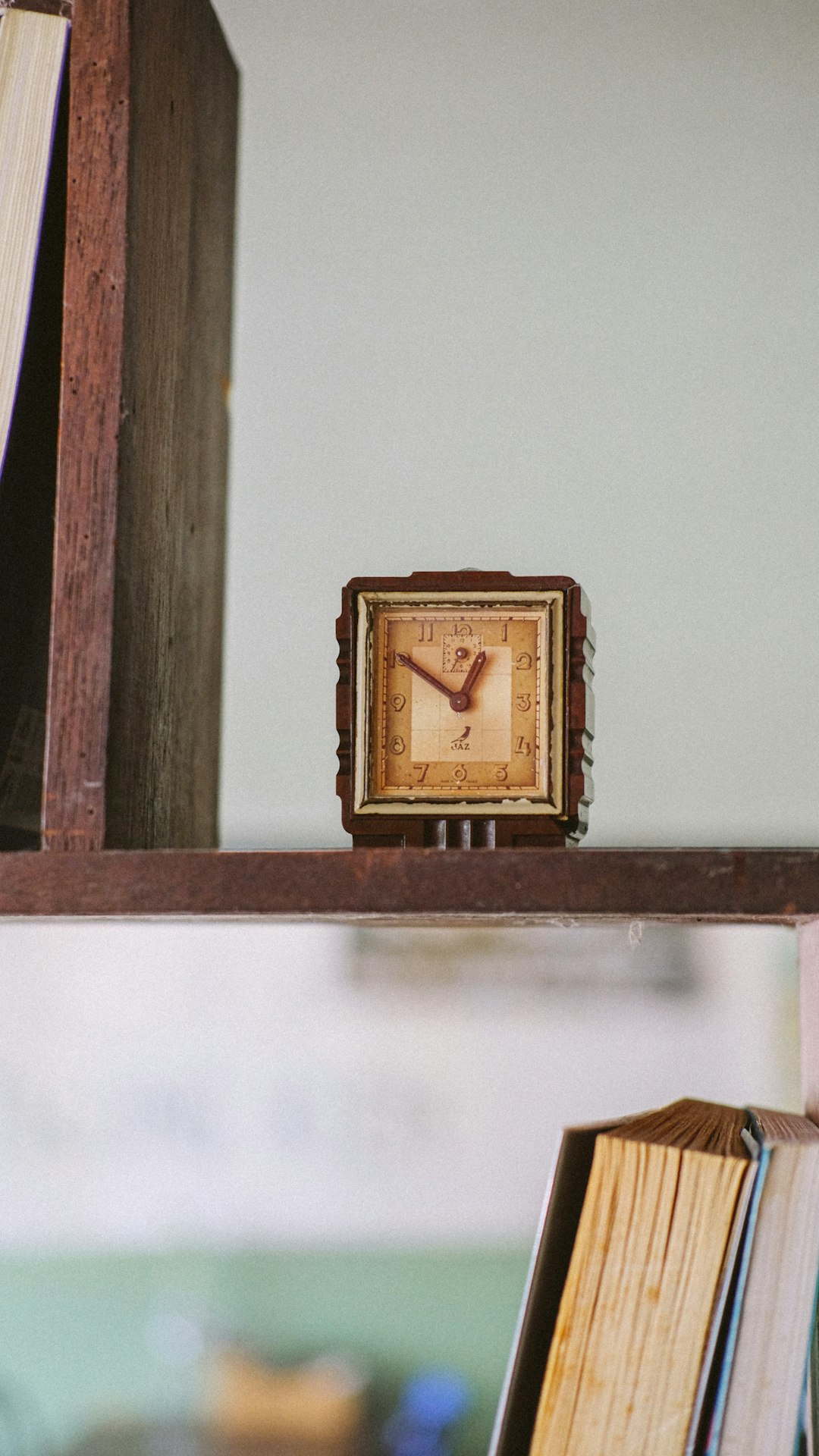 brown wooden analog wall clock