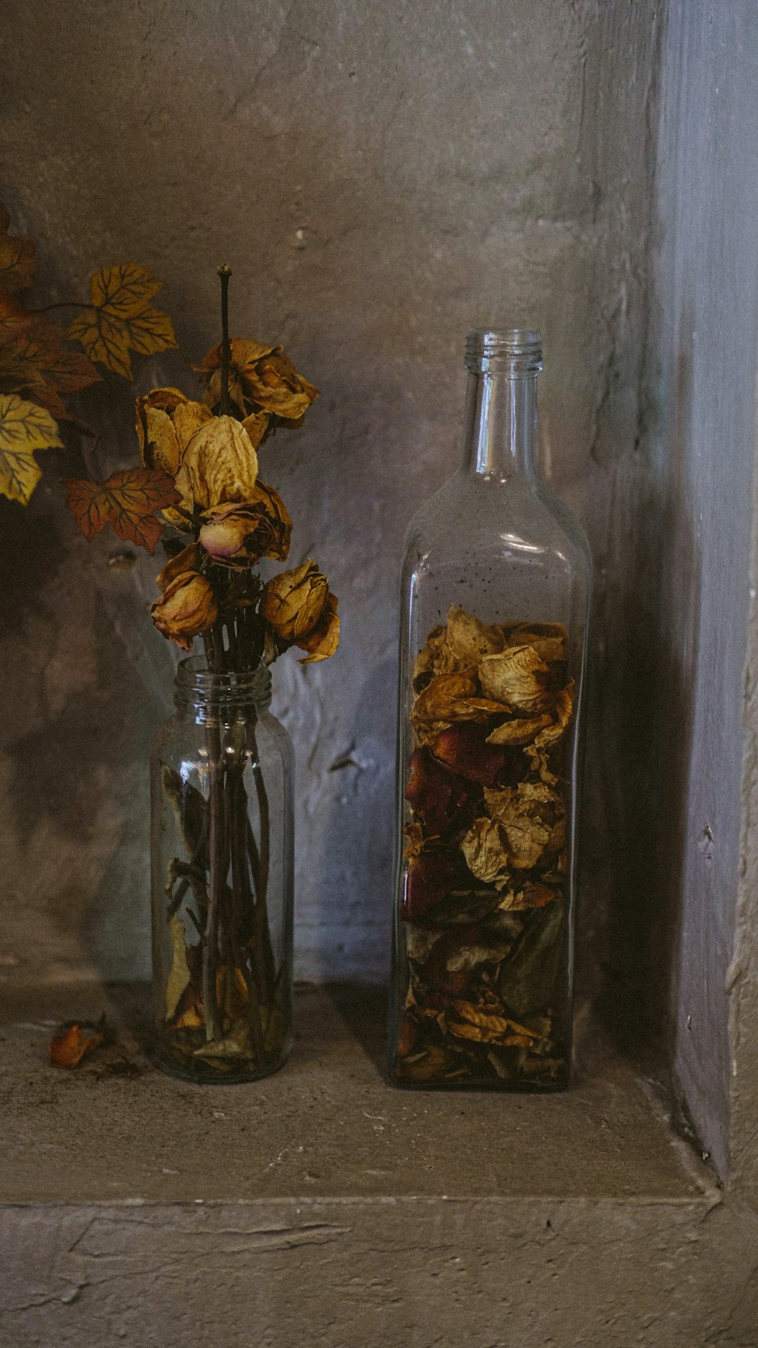 brown and yellow flower in glass bottle