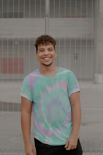 smiling girl in pink and green crew neck t-shirt