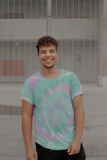 smiling girl in pink and green crew neck t-shirt