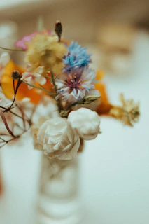 A soft-focus photo capturing a blush-toned bouquet with delicate rose gold ribbons.