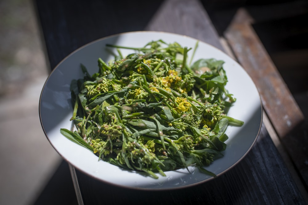 green vegetable on white ceramic plate