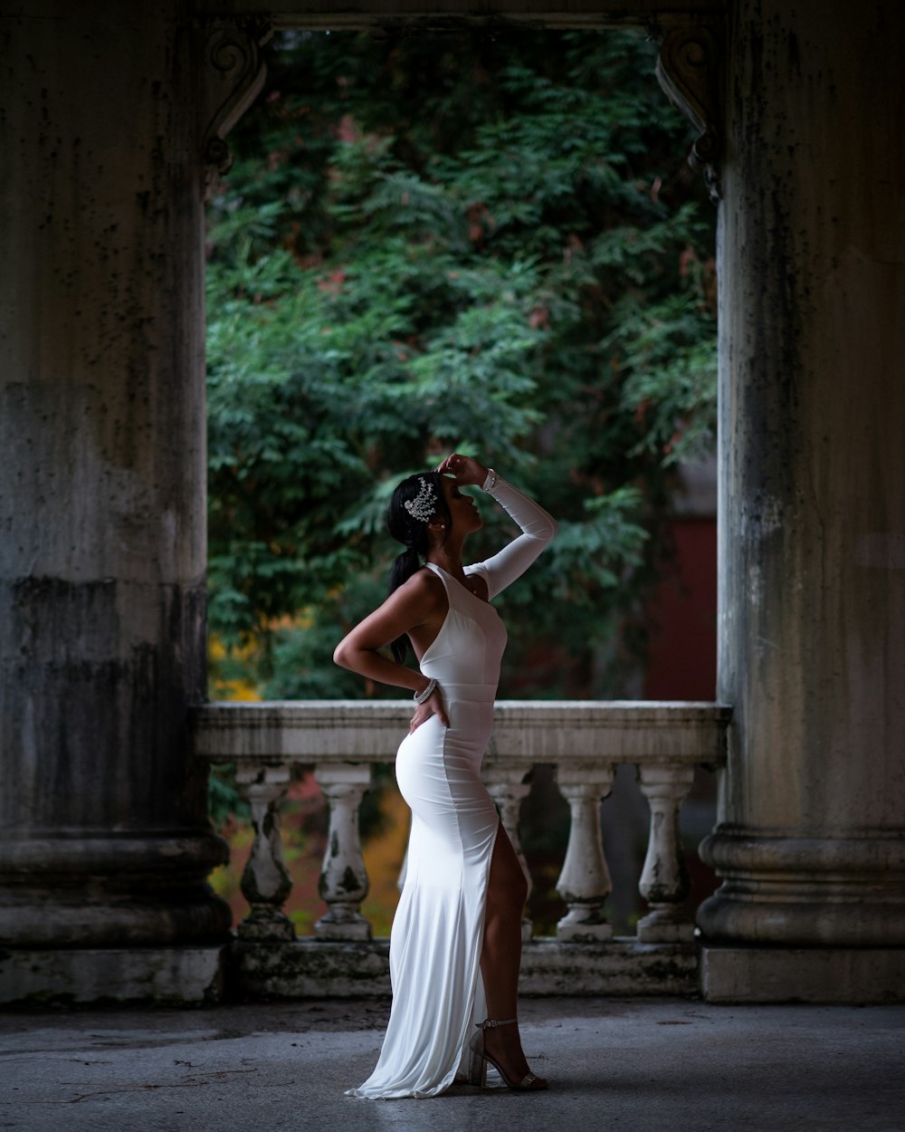 woman in white dress holding camera