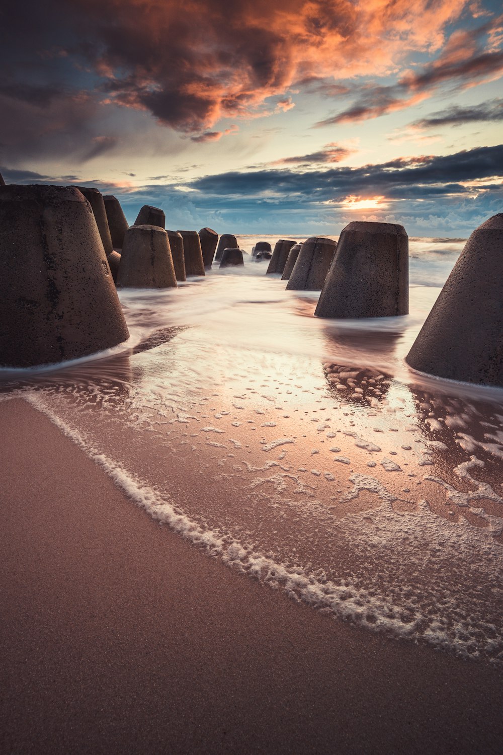 grayscale photo of beach with water waves