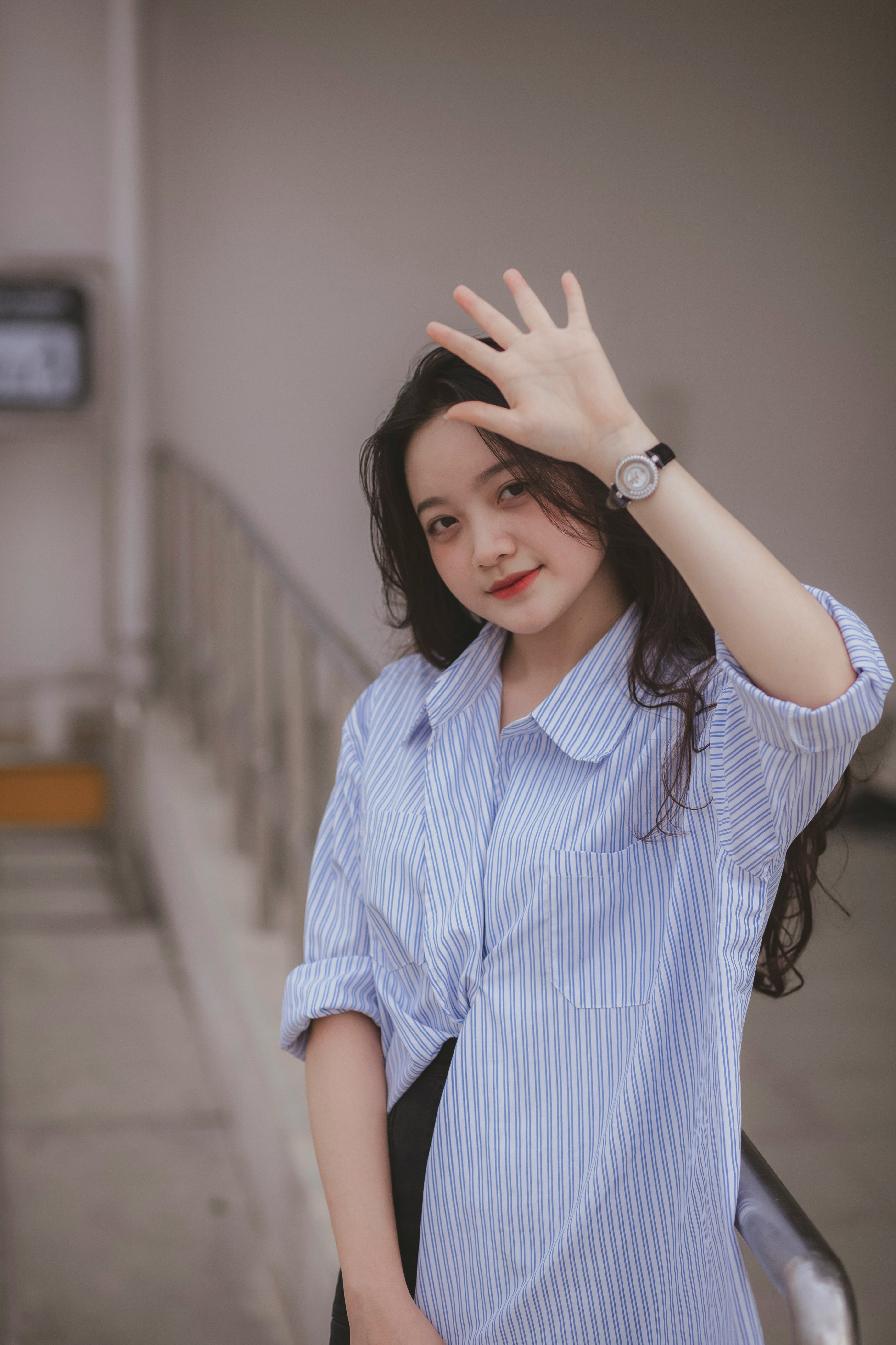 woman in white and blue stripe button up shirt