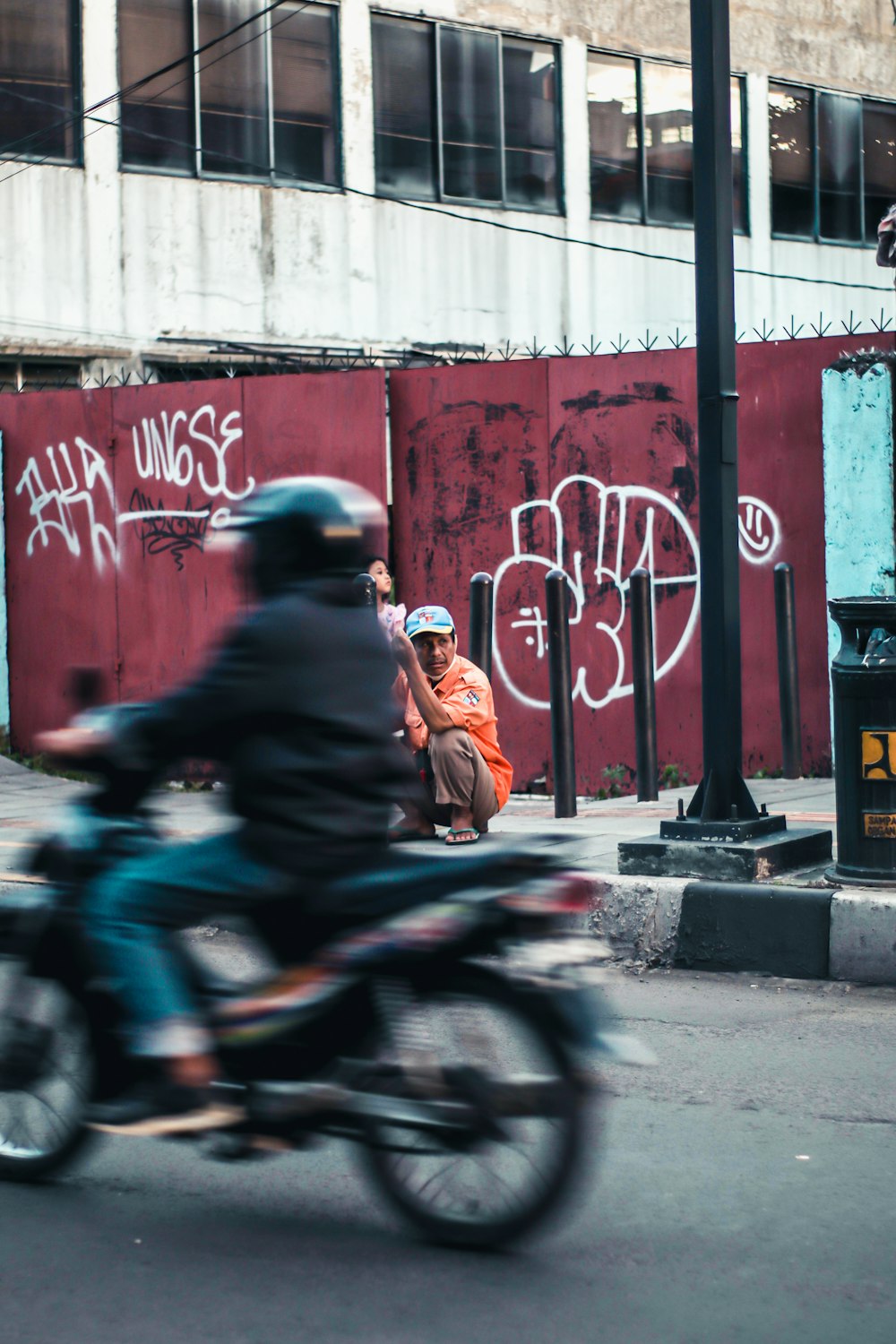 man in brown jacket riding motorcycle during daytime