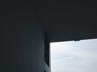 Minimalist architecture framed by stark shadows and light.