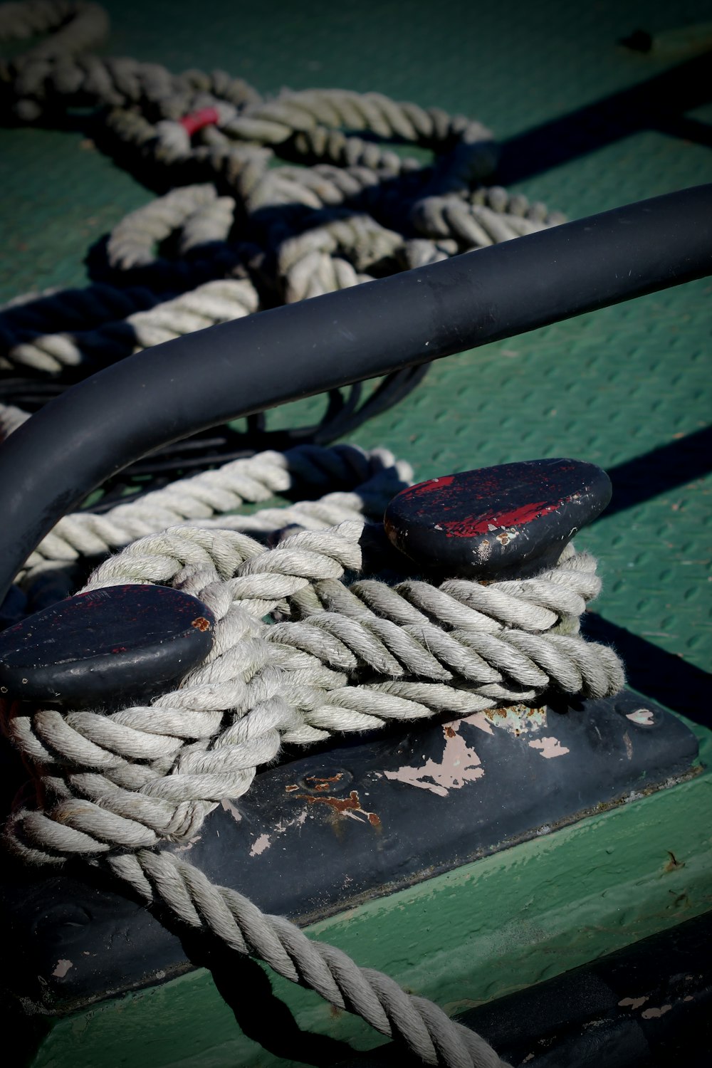 blue and white rope on green wooden board