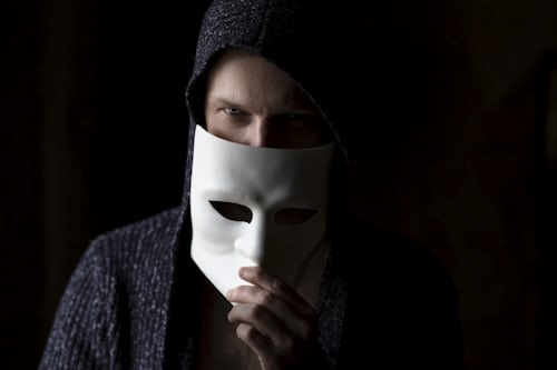Picture of man with mask in front of his face, like the true image these generators hide