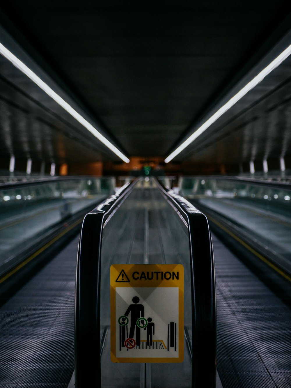 black and silver escalator in a train station