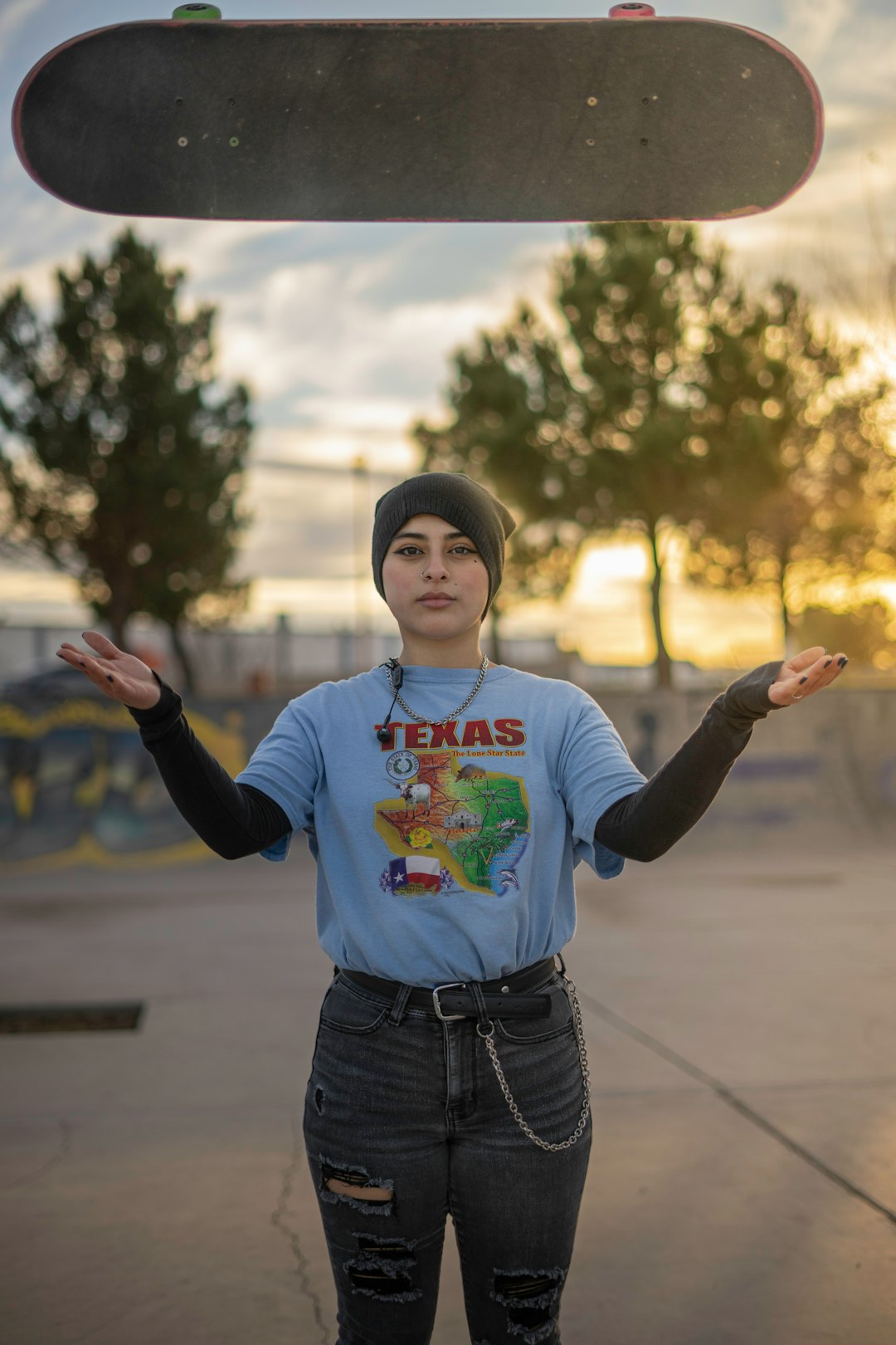 boy in red and white sweater and blue denim jeans standing on road during daytime