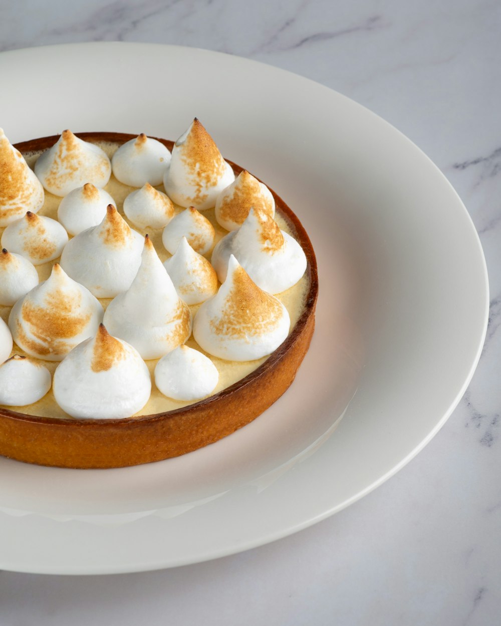 white and brown bread on white ceramic plate