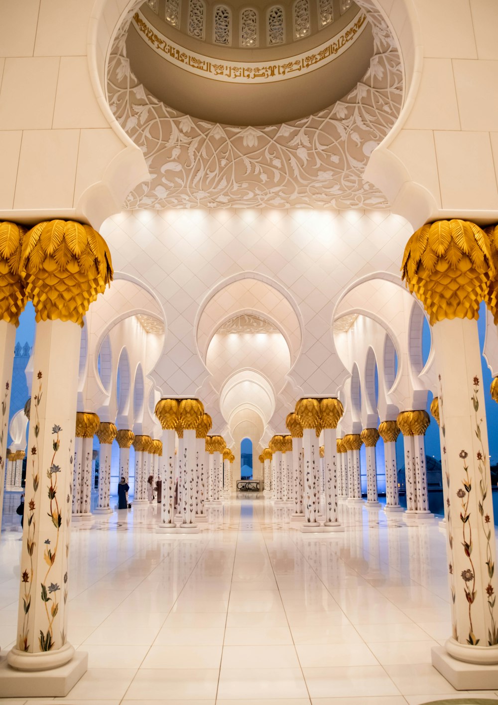 white and gold chandelier on white ceiling