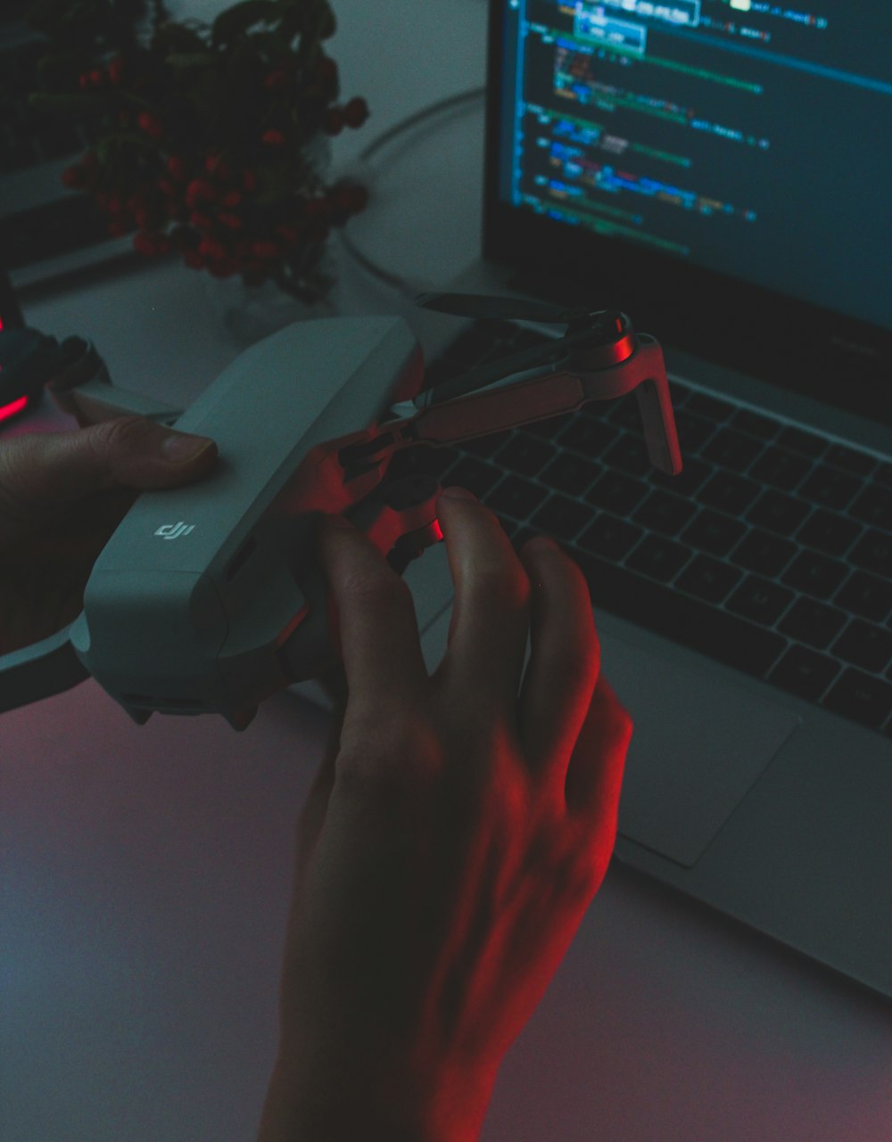 person holding black and red plastic tool