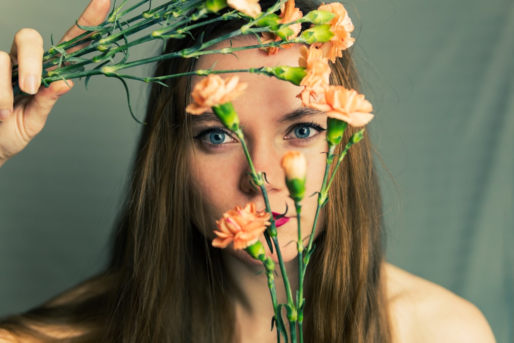 woman with yellow and white flower on her head