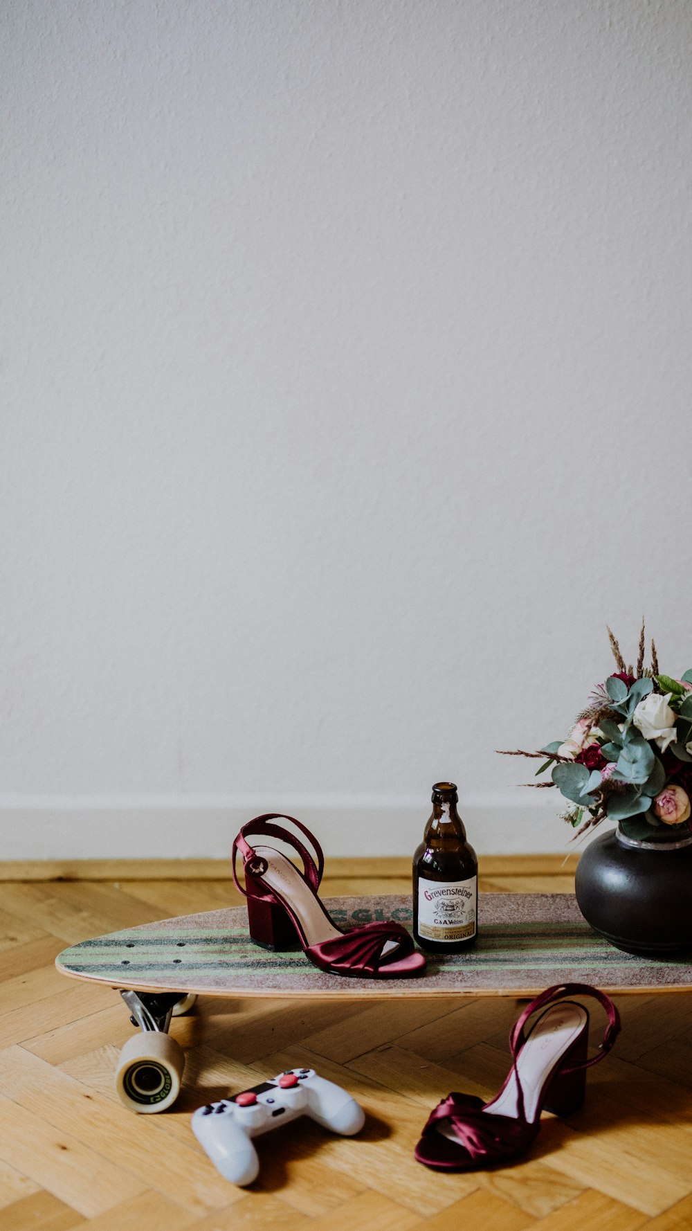 brown glass bottle beside black vase