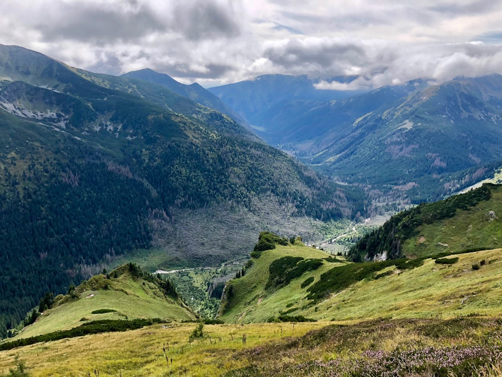 green mountains under white clouds during daytime