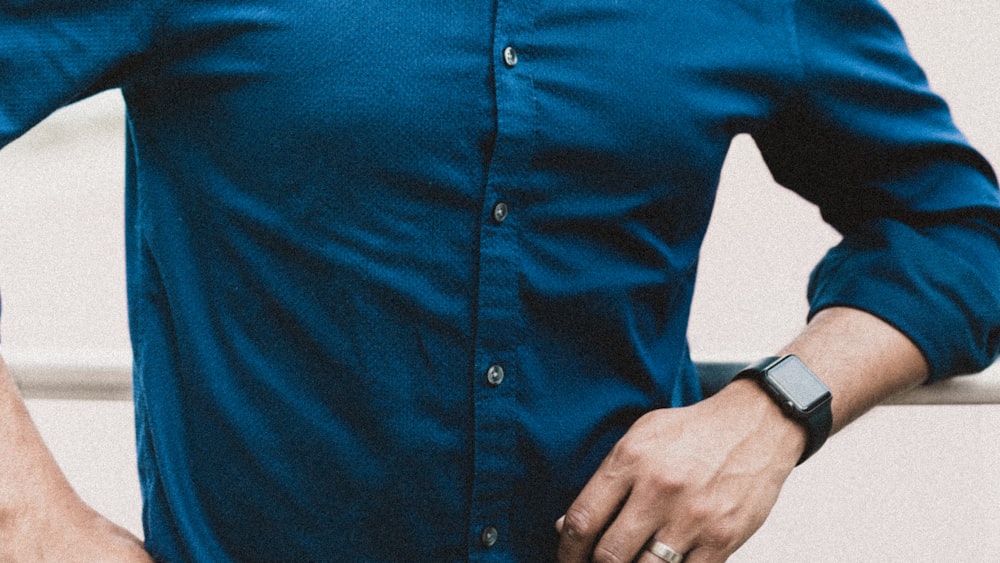 person in blue button up long sleeve shirt