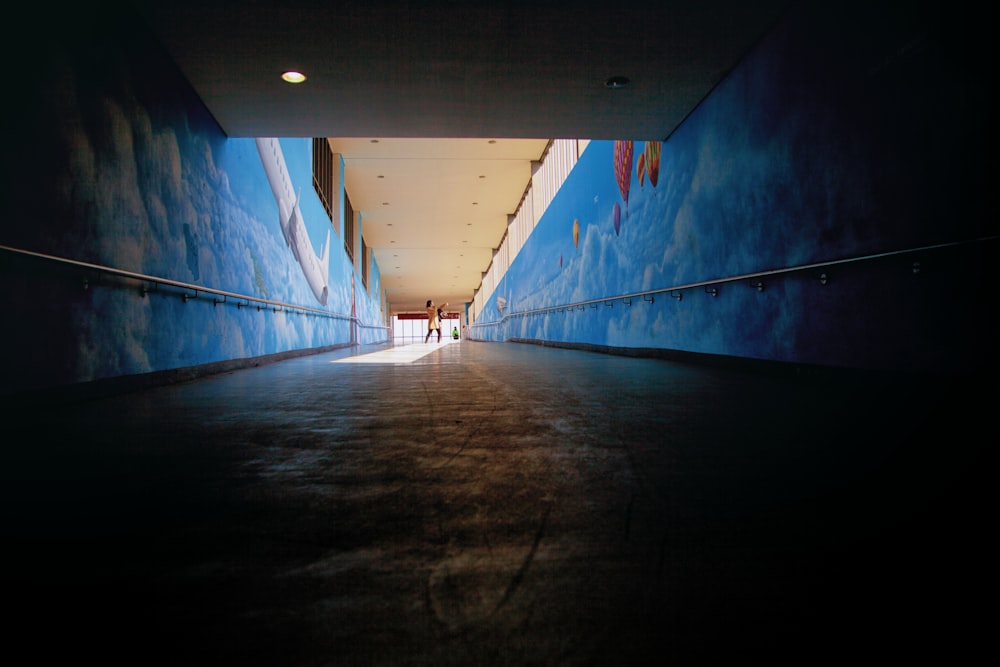blue and white tunnel with white light
