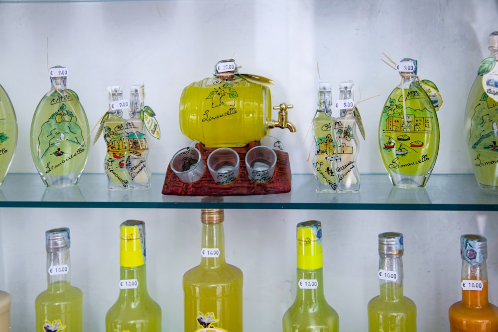 assorted bottles on glass shelf