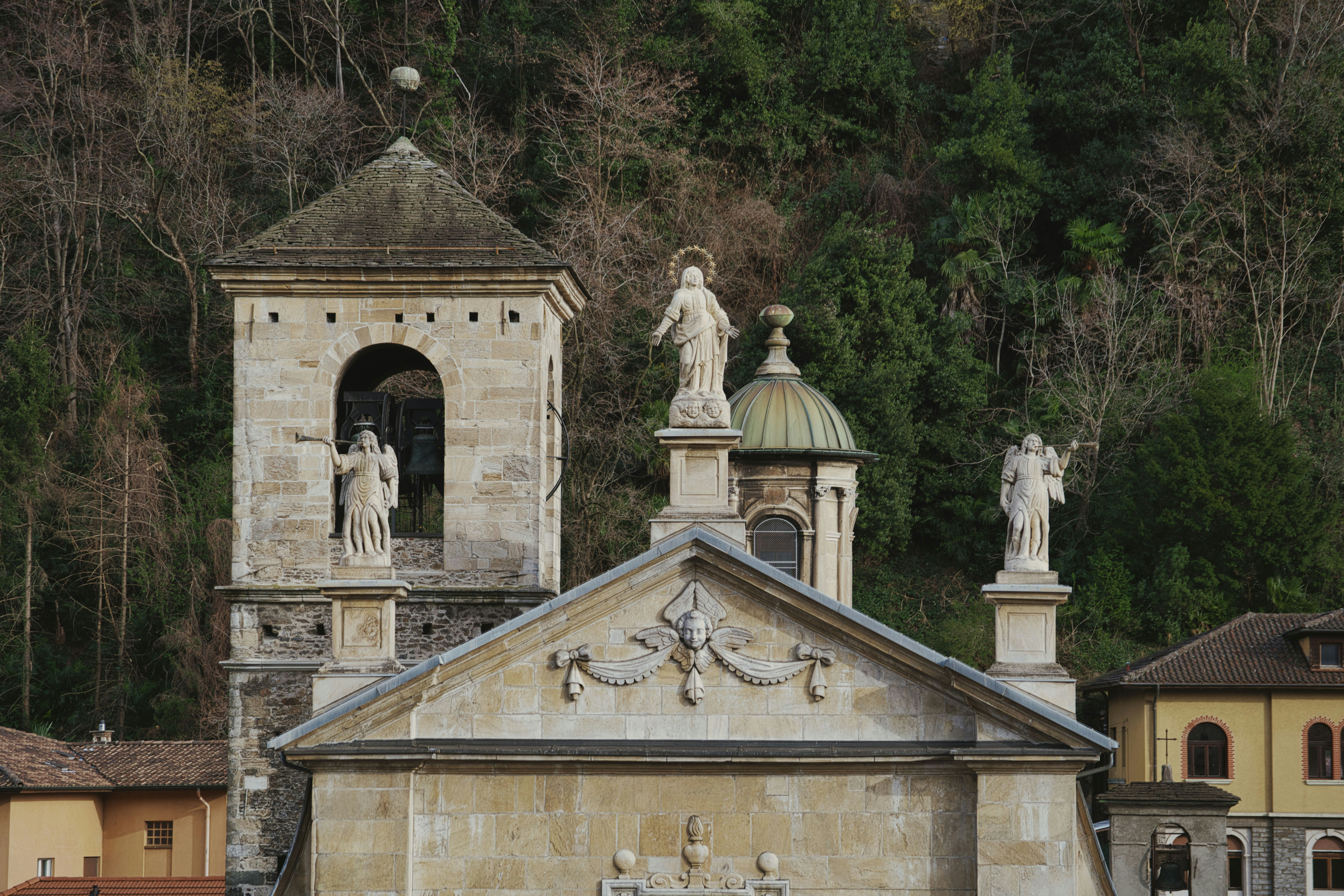 white concrete building near green trees during daytime