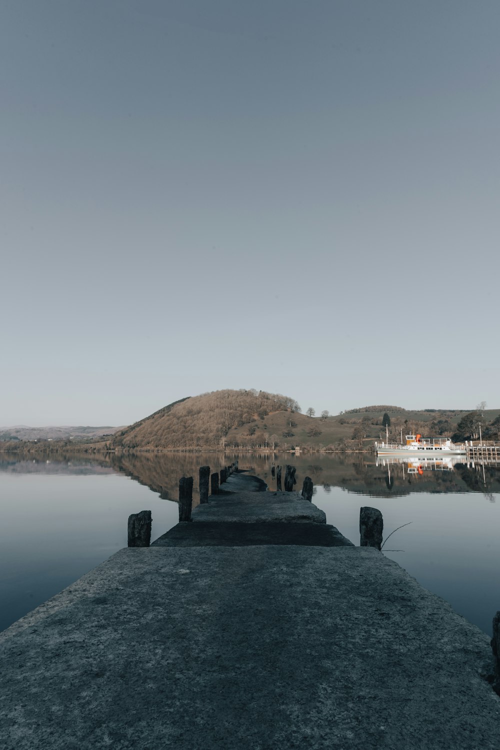 brown concrete building near body of water during daytime