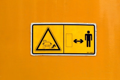 yellow and black no smoking sign