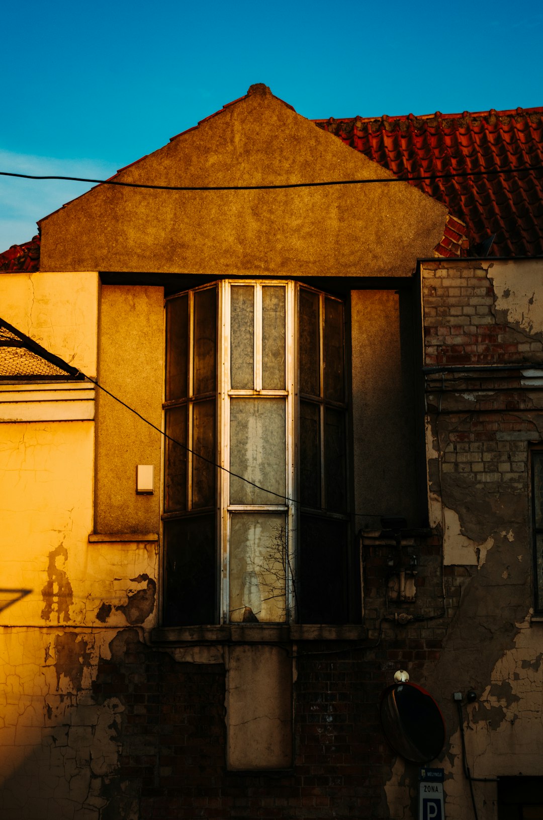 brown brick building with black window frame