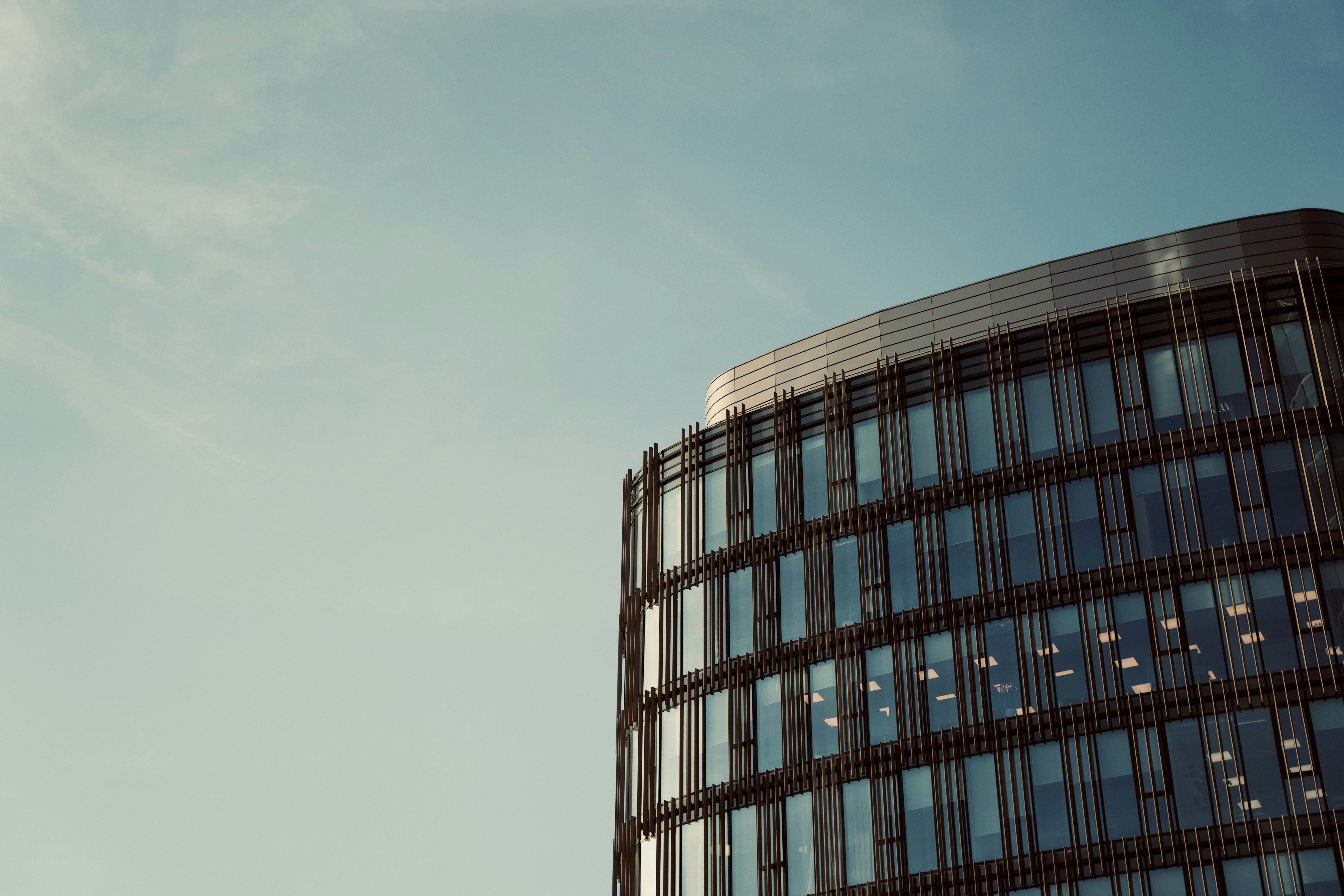 blue glass walled high rise building