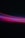 A photograph capturing vibrant streaks of light in various colors against a dark background. The lights form a wave-like pattern with predominant hues of red, purple, and blue.