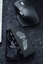 A happy customer unboxing a new mouse from one click’s online store.