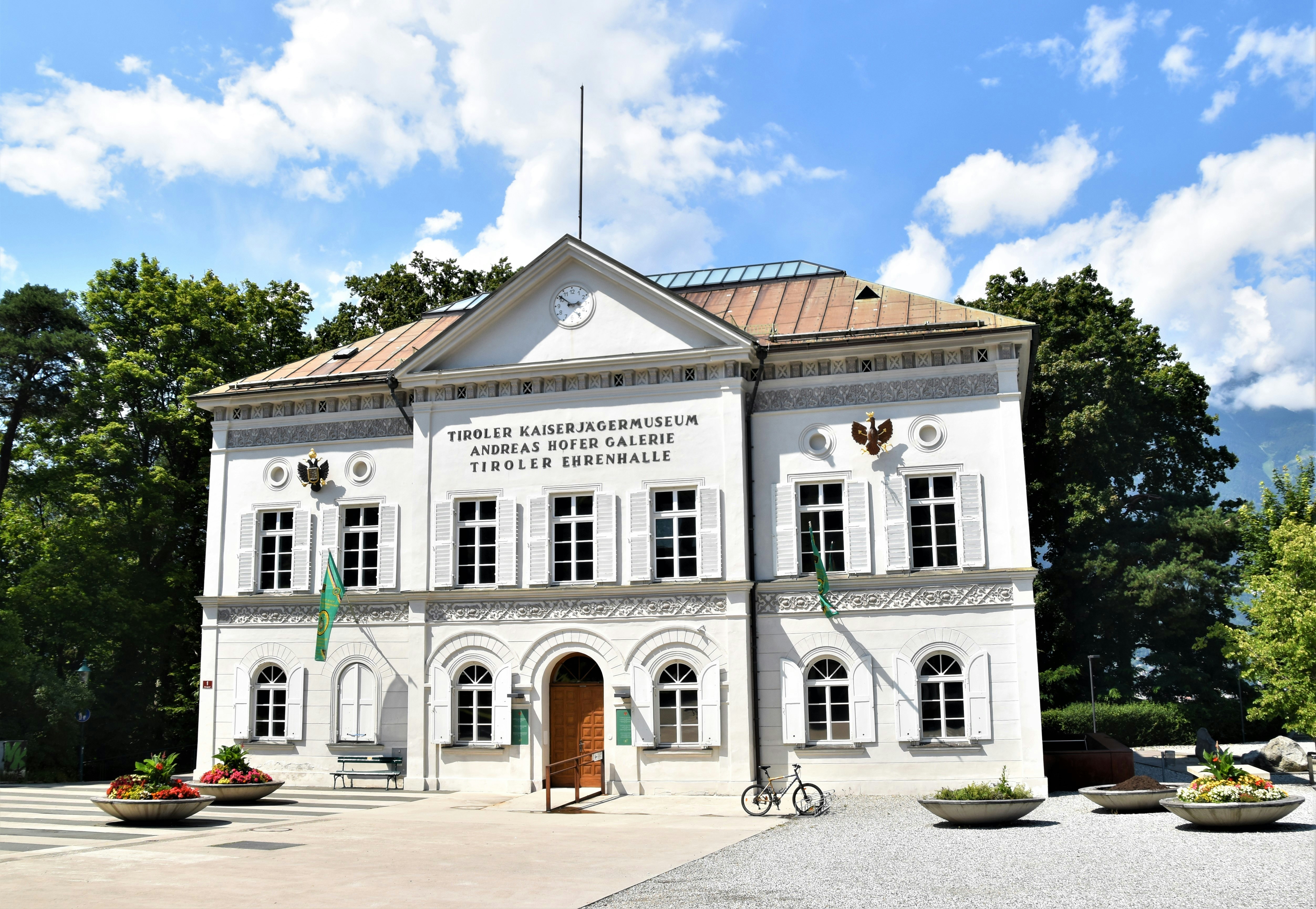 white and brown concrete building under blue sky during daytime