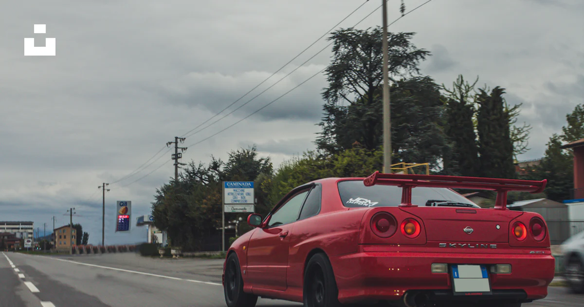 Red car on road during daytime photo – Free Car Image on Unsplash