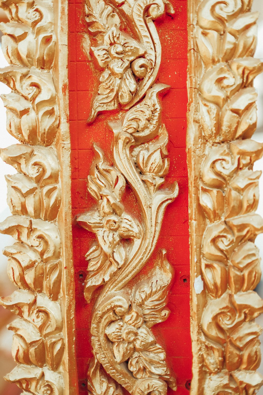 gold and red floral embossed wall decor