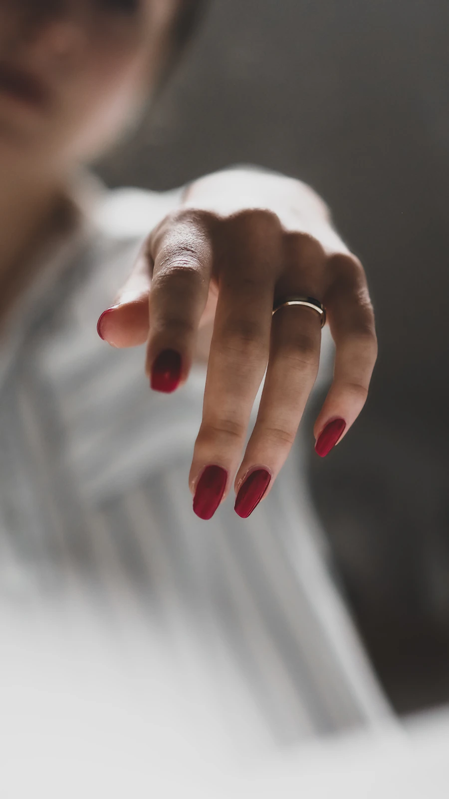 Silver ring on manicured hand