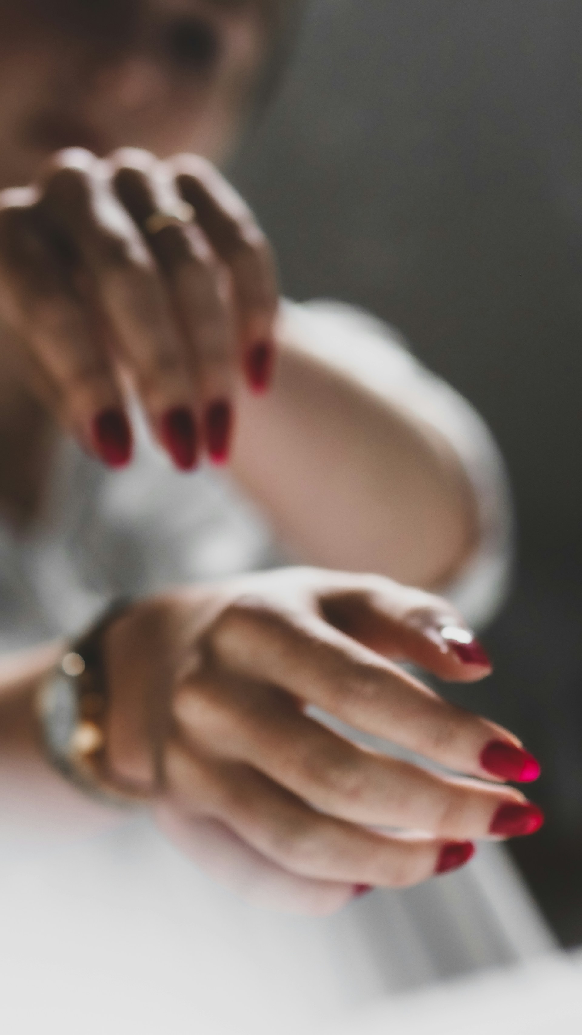 Close-up of hands clapping rhythmically, highlighting the intricate nail movements and emotional intensity of flamenco.