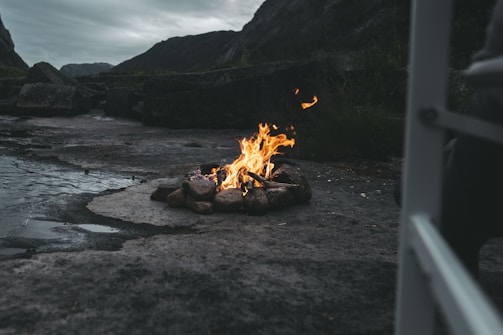 Community members sharing stories around a campfire near the Cuesta stones
