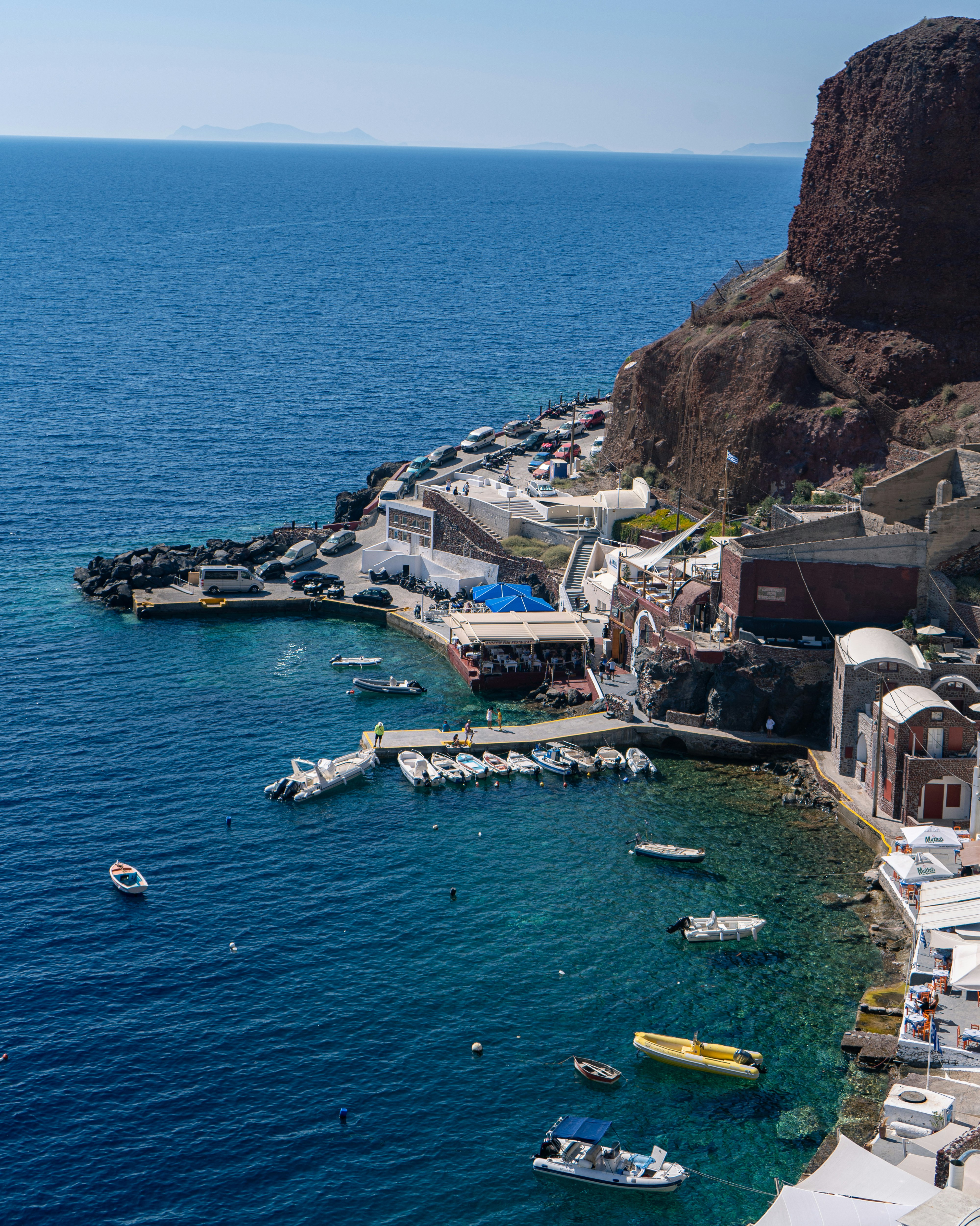 aerial view of boats on sea near houses during daytime