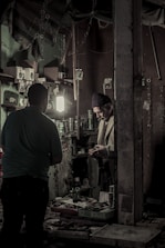 Artisan carefully assembling a custom gift box in a warm, cozy workshop.